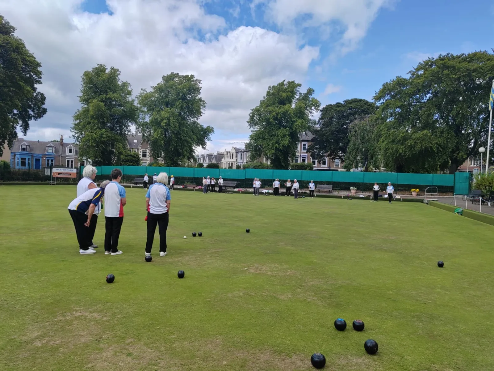 Bowlers watching the head on a sunny day