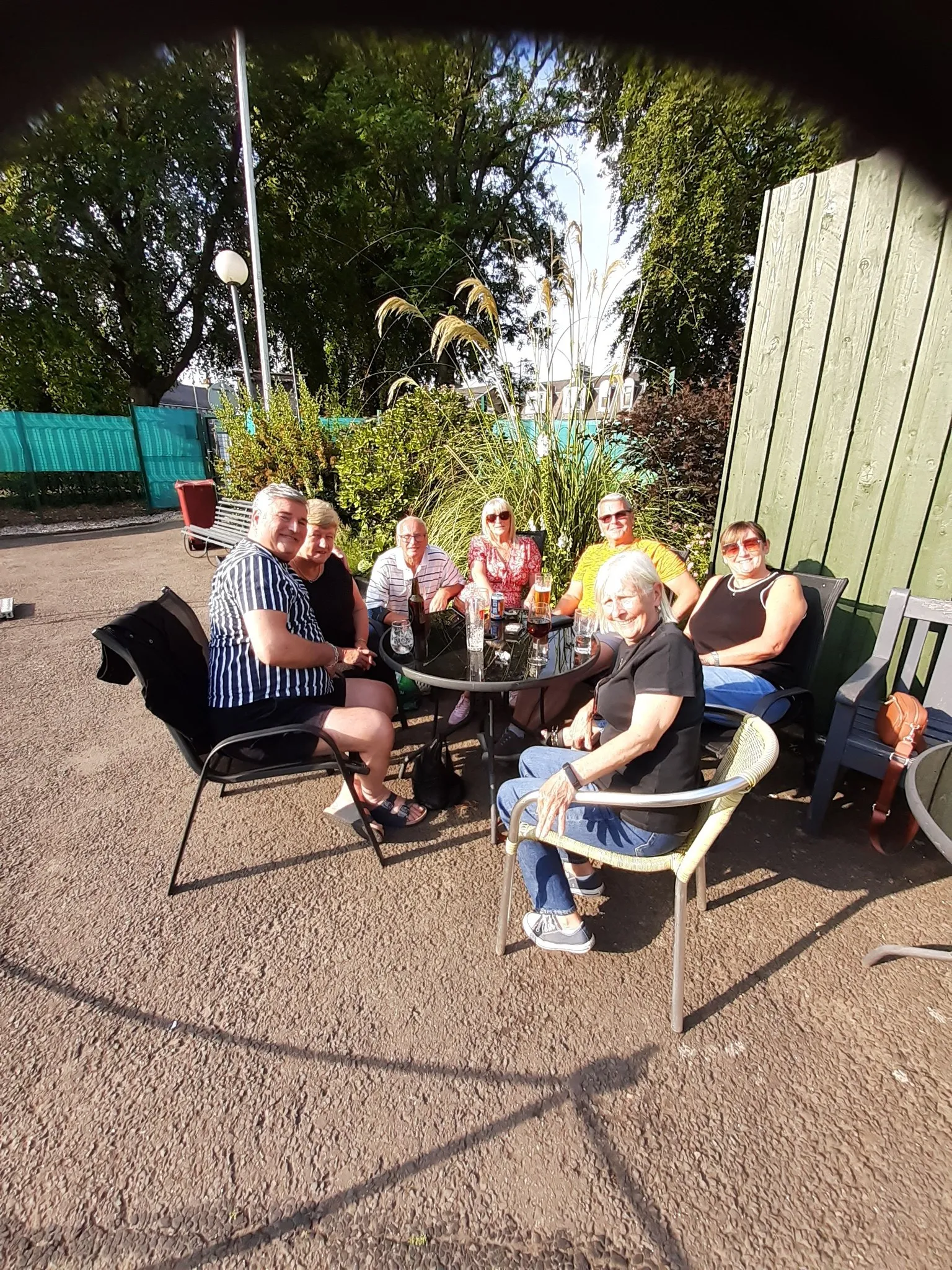 Members relaxing outside the clubhouse