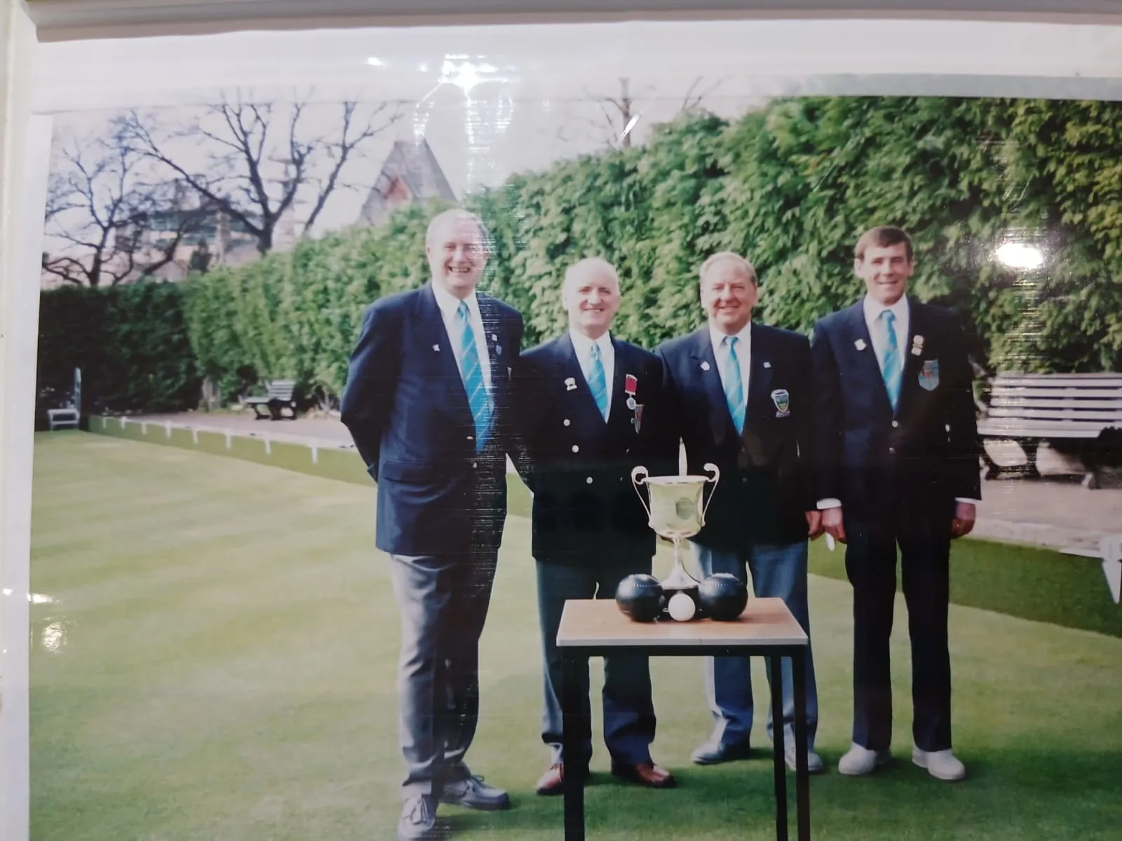 Winners with a trophy on the green, from the club archive